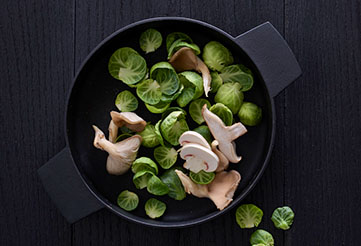Brussels sprouts and mushrooms in a bowl